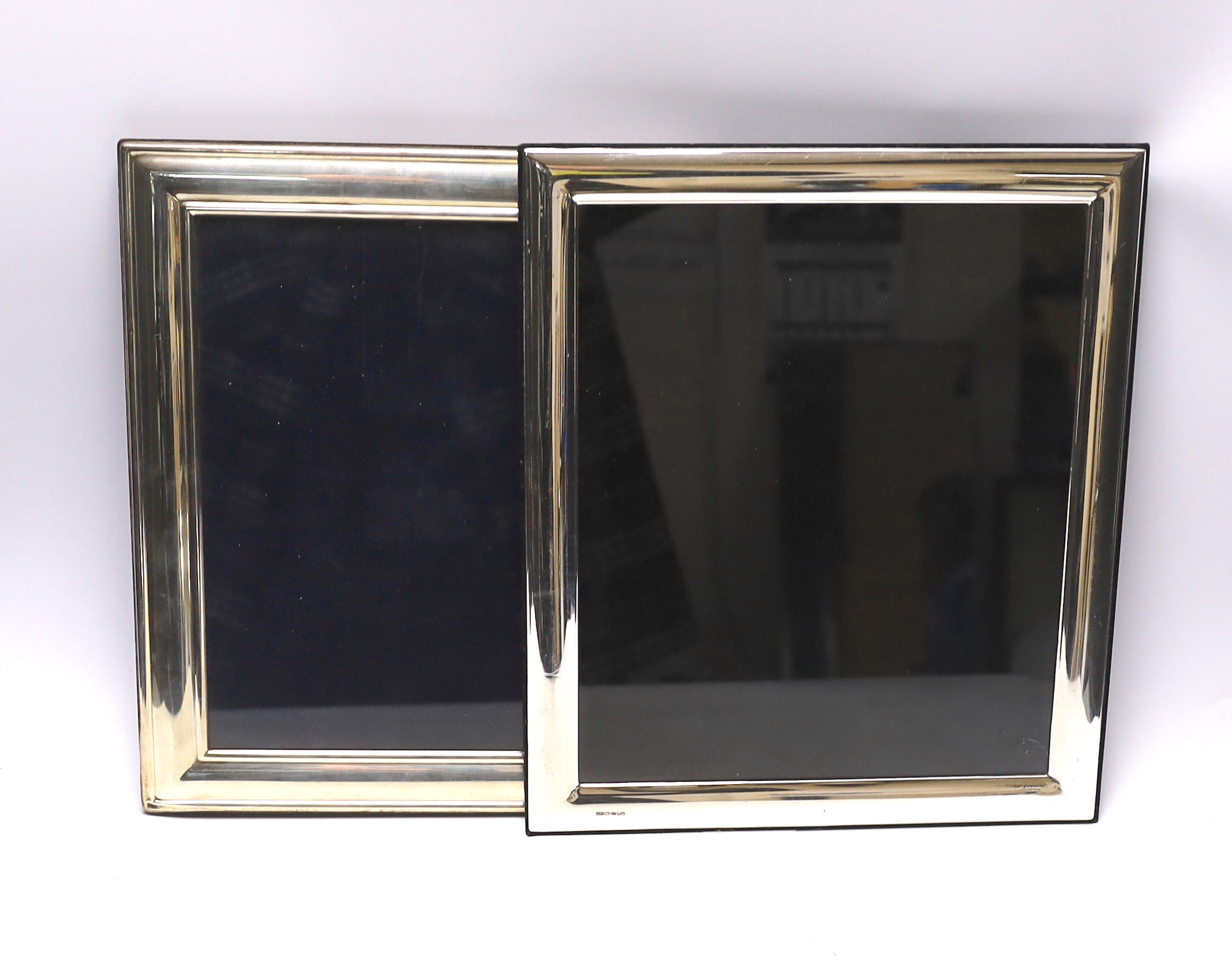 Two large modern silver mounted rectangular photograph frames, 32.9cm and 32cm.